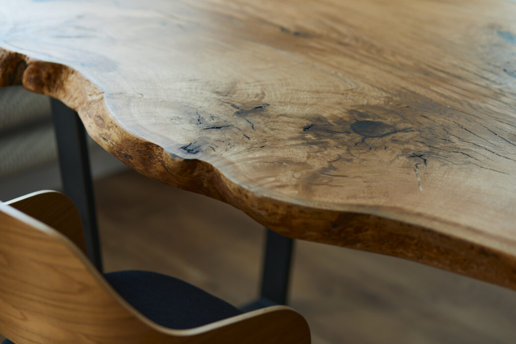 Stylish compositon of craft oak wooden table with chairs and mod
